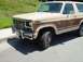 1986 Ford Bronco - Left side of truck. The fender absorbed most of the hit. The bumper was at a 90 degree angle. A wall and some engine power took care of tha…