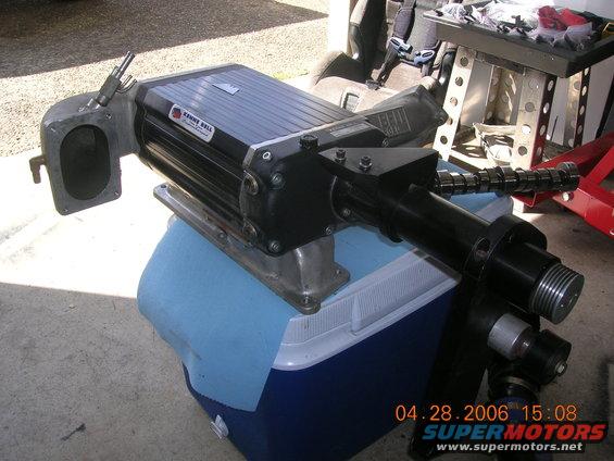 Kenne Bell supercharger sitting on a cooler. Camshaft visible