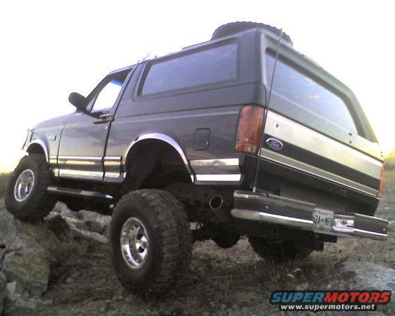 Dark 1995 Ford Bronco 3/4 front view on rocks