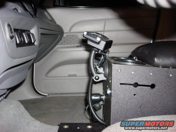 2003 Ford Crown Victoria interior console with radio equipment and cup holders
