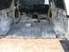 1978 Ford Bronco - The interior of a 1978 Ford Bronco is shown stripped down, ready for a redo, with exposed metal flooring and dashboard visible.