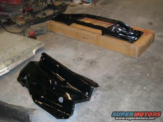 bodyworkpaintpics-012.jpg New Inner fender aprons and radiator core support. They are painted black and cleared.