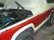 1978 Ford Bronco - This 1978 Ford Bronco is undergoing a paint job, with the hood open to reveal the engine compartment.