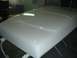 1978 Ford Bronco - A freshly painted vehicle hood is shown in a workshop setting.