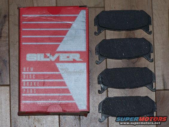 Silver brand new disc brake pads in red box, with four pads shown