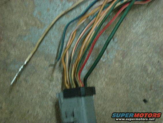Wiring harness with multiple colored wires connected to a gray connector