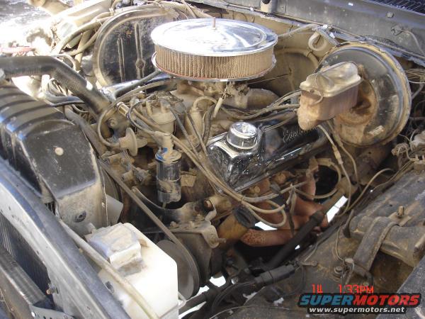Engine bay with air cleaner, master cylinder, and engine components visible. Watermark shows 1:33 PM