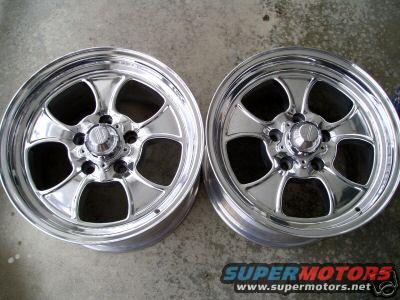 Two chrome five-spoke wheels with polished lips