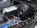 1978 Ford Bronco - Close-up of a brake booster and master cylinder assembly, showing brake lines and wiring.
