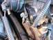 1985 Ford Crown Victoria LTD - Carburetor linkage detail, showing springs and mechanical connections.