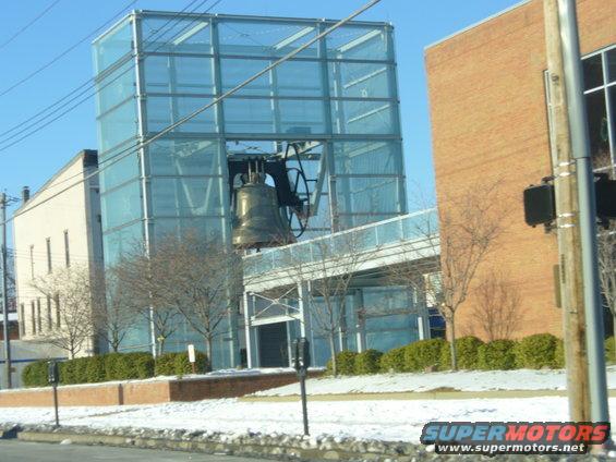 Liberty Bell is housed in a modern glass structure next to a brick building