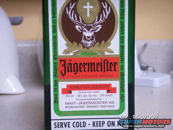 Jägermeister bottle label with deer and cross emblem, text in German and English