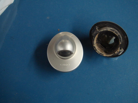 Ford license plate light assembly with part number visible
