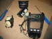 1995 Ford C-350 (Centurion Conversions) - Disassembled overhead console with exposed wiring and components, alongside tools and screws on a cardboard surface.