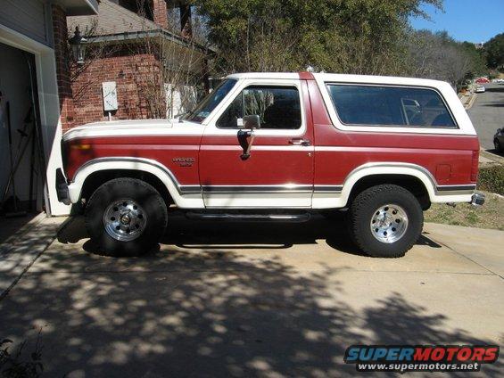 Red and white 1986 Ford Bronco side view