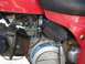 1900 Honda Big Red - A detailed view of a motorcycle's engine components, including the carburetor and air filter assembly.