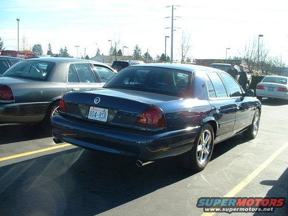2000 Ford Crown Victoria rear view, parked next to another sedan