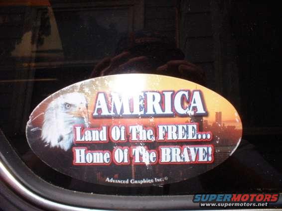 Oval sticker with eagle and text 'AMERICA Land Of The FREE... Home Of The BRAVE!'