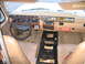 1984 Ford F-350 - The dashboard and interior of an older vehicle, a custom switch panel and aftermarket stereo.