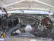 1984 Ford F-350 - The engine compartment of a vehicle, showing various components and wiring.