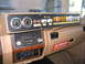 1984 Ford F-350 - Custom dashboard in a 1984 Ford F-350 features gauges, switches, and an aftermarket stereo system.