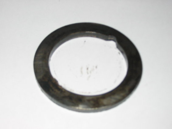 close-up of a dark metal ring with a white background