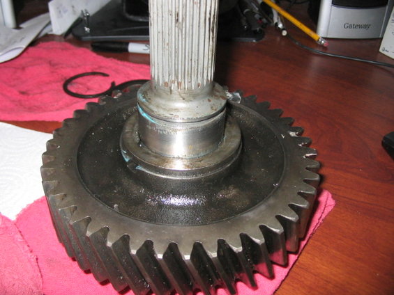 Gear and shaft assembly on a pink cloth