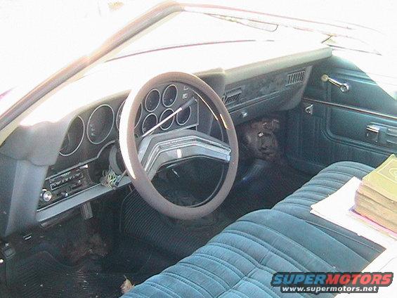1973 Ford Ranchero interior with blue velour seats and dashboard gauges