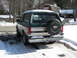 1994 Ford Bronco - Rear view of a 1994 Ford Bronco parked in the snow.