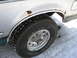 1994 Ford Bronco - This 1994 Ford Bronco shows significant rust around the rear wheel well, with a Kelly Safari AWR tire visible.