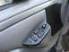 1994 Ford Bronco - The interior door panel features power window controls for both driver and passenger sides, along with a door lock switch.