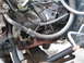 1994 Ford Bronco - The engine bay of a vehicle, with various components and wiring visible.