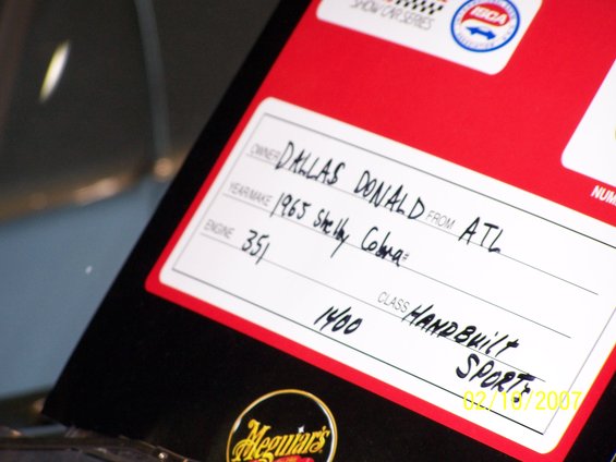 Card for a 1965 Shelby Cobra, owner Dallas Donald from ATL, engine 351, class handbuilt sport, dated 02/18/2007