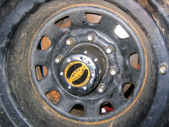 Warn locking hub on a black wheel