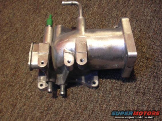 Aluminum intake manifold part with green sensor and metal tubes
