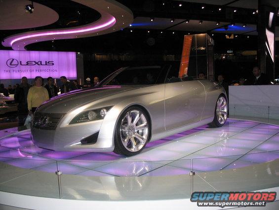 Silver convertible concept car on display with Lexus branding in background