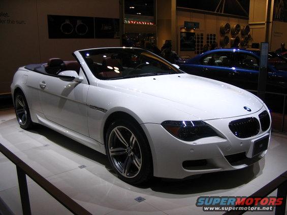 White convertible with brown interior on display, front quarter view