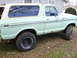 1979 Ford Bronco - This vintage Ford Bronco is shown from the side, its distinctive two-tone paint and tires.