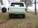 1979 Ford Bronco - This Ford Bronco, likely from the late 1970s, is parked outdoors next to a house and some trees.