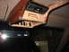 1995 Ford C-350 (Centurion Conversions) - Custom overhead console with numerous switches and unfinished wood trim is installed in a vehicle.