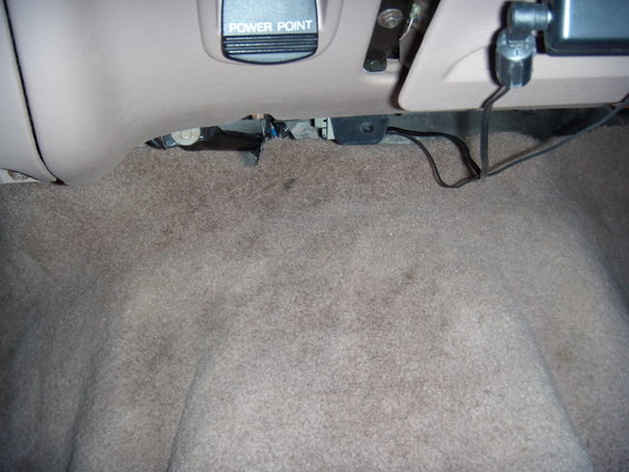 Interior car floor showing carpet and a "Power Point" outlet