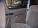 1992 Ford Bronco - Interior view of a 1992 Ford Bronco, with a dark SUV reflected in the window.