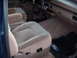 1992 Ford Bronco - Interior view of a 1992 Ford Bronco, highlighting the tan upholstery and dashboard details.