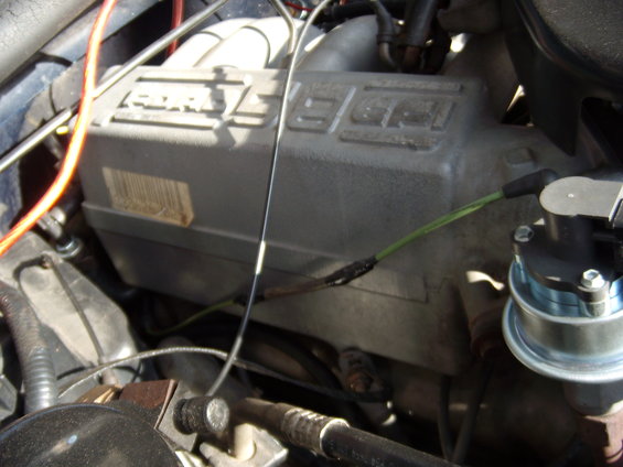 Close-up of a Ford engine intake manifold with visible wiring and a sensor