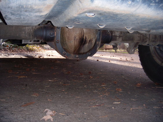Underside view of a vehicle's rear differential and axle housing