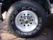 1992 Ford Bronco - A close-up shot focuses on the tire and wheel assembly of a vehicle.