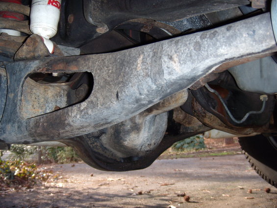 Rear axle and suspension components with visible shock absorber labeled 'RS'