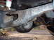 1992 Ford Bronco - Underside view of rear axle and suspension components, including a shock absorber with 'RS' visible.