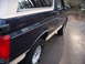 1992 Ford Bronco - The side profile of a 1992 Ford Bronco shows its two-tone paint scheme and classic SUV body style.