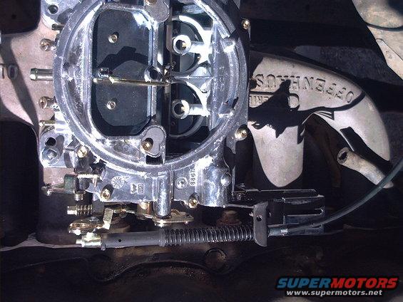 Close-up of a carburetor with "OFFENHAUS" stamped on a nearby metal part